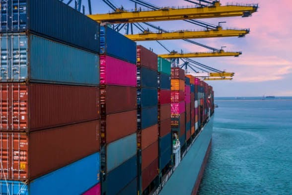 Shipping containers and cargo cranes at a seaport