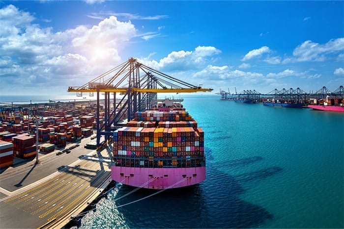 Container vessel being loaded at an international shipping port
